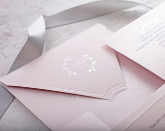 Pink paper with elegant silver foil premium blush pink wedding invites