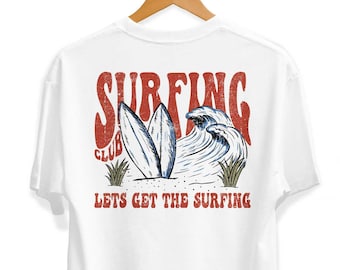 May include: White t-shirt with a red and blue graphic print of surfboards and waves. The text "SURFING CLUB" and "LETS GET THE SURFING" is printed on the shirt.