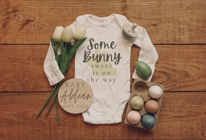 digital pregnancy announcement. long sleeve baby onesie that reads "some bunny sweet is on the way" with a wooden circle including last name and due date of baby. digital download