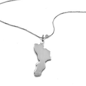May include: A silver necklace with a pendant shaped like the island of Guam. The pendant is attached to a delicate silver chain.