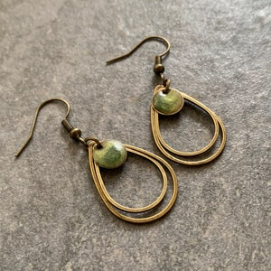 Minimalist hanging earrings with green resin image 5