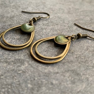 Minimalist hanging earrings with green resin