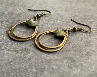 Minimalist hanging earrings with green resin