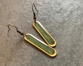 Brass earrings filled with resin, green metallic