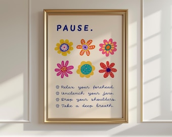 May include: A framed print with the word "PAUSE" in blue above six colorful flower illustrations. Below, the print includes instructions: "Relax your forehead. Unclench your jaw. Drop your shoulders. Take a deep breath."