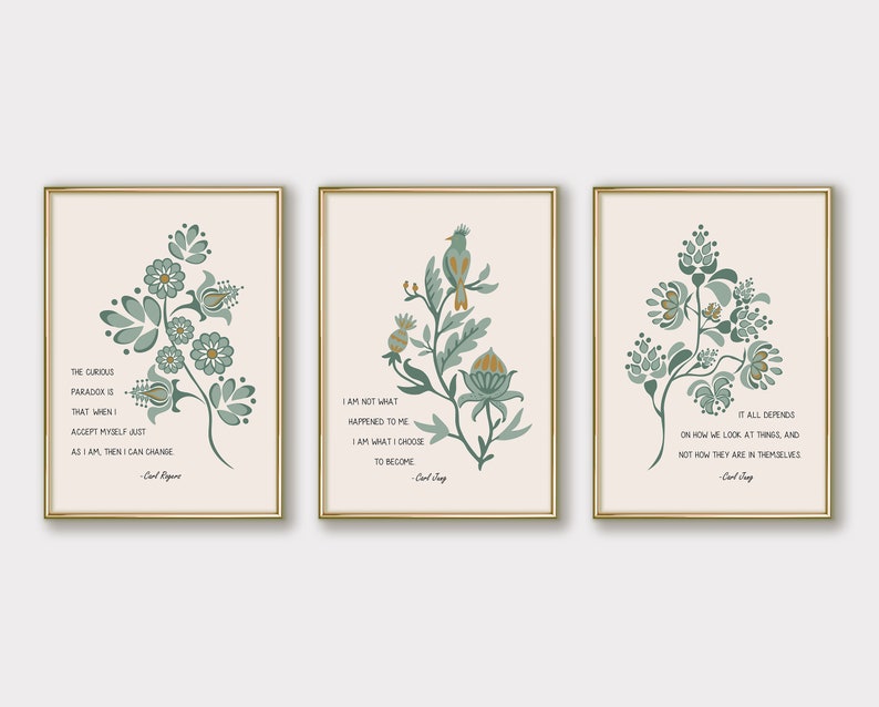 May include: Three printable wall art prints with a cream background and gold frames. Each print features a green floral design with a quote by Carl Jung. The first print says "The curious paradox is that when I accept myself just as I am, then I can change". The second print says "I am not what happened to me. I am what I choose to become". The third print says "It all depends on how we look at things, and not how they are in themselves".