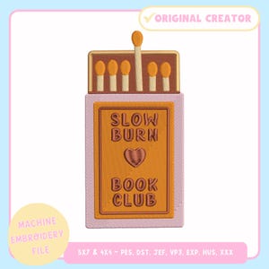 May include: An embroidered patch in the shape of a matchbox, featuring the text "SLOW BURN BOOK CLUB." The design includes a heart symbol and several matchsticks. The patch is in shades of brown, orange, and pink, with a light blue background.