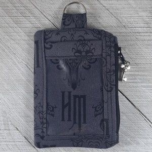 Bolsa de identificación/portaidentificación inspirada en Disney. Logotipo de la Mansión Encantada de Disneyland, ícono de fondo de pantalla de la Mansión Encantada.