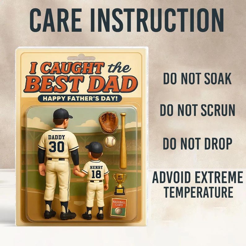 May include: A Father's Day gift set featuring two baseball figures, a glove, a bat, a baseball, and a trophy. The text reads "I Caught the Best Dad" and "Happy Father's Day!" Care instructions are also included.