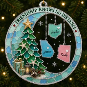 May include: A circular Christmas ornament featuring a green Christmas tree decorated with starfish and pearls, a lantern, and gifts. Three state-shaped charms hang from the top, labeled Sophie, Jessica, and Emily. The text reads Friendship Knows No Distance.