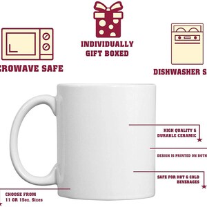May include: A white ceramic mug with a curved handle. The mug is labeled "Microwave Safe" and "Dishwasher Safe." Text on the mug indicates it is safe for hot and cold beverages and is available in 11 or 15 oz sizes. The mug is individually gift boxed.