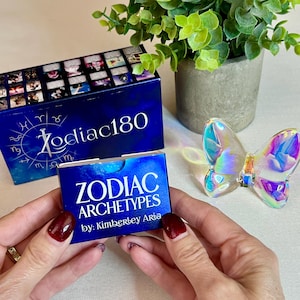May include: A blue box with the text "Zodiac180" and a smaller blue box with the text "Zodiac Archetypes by: Kimberbey Arba".