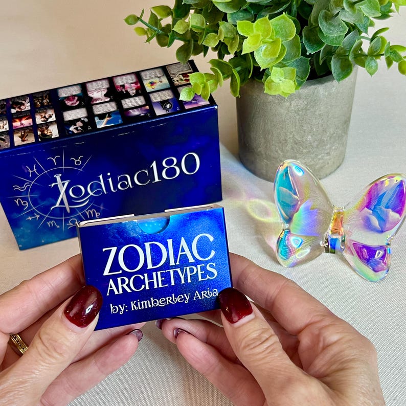 May include: A blue box with the text "Zodiac180" and a smaller blue box with the text "Zodiac Archetypes by: Kimberbey Arba".