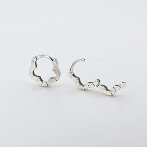 These platinum hoop earrings showcase a modern floral-inspired design, blending soft petal-like curves with a sleek geometric edge. Crafted in premium platinum, they radiate understated elegance while remaining durable for everyday wear. Lightweight and versatile, they effortlessly complement both casual and formal outfits. A refined expression of timeless style, these earrings make a graceful addition to any jewellery collection. Lever Back Earrings