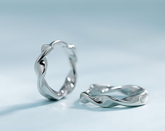 Pt950 Platinum Mobius-ringoorbellen: minimalistisch gedraaid unisex-ontwerp