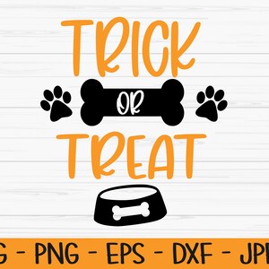 Puede incluir: Texto naranja sobre un fondo de madera blanca que dice "Trick or Treat" con un hueso negro y huellas de patas. Debajo del texto hay un cuenco negro para perros con un hueso dentro.