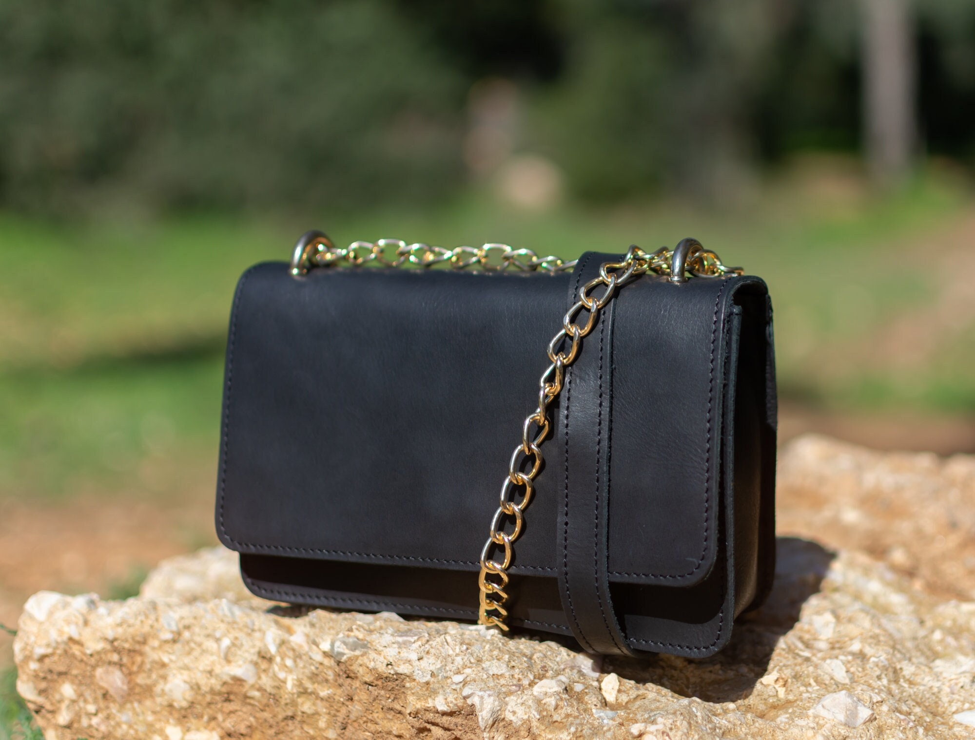 Stylish Solid Black Sling Bag with Gold Chain Including Free Gift.