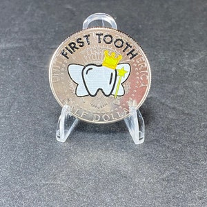 Our uncirculated First Tooth JFK Tooth Fairy Coin comes in a protective coin holder and packaged in a gift box.