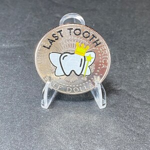Our uncirculated Last Tooth JFK Tooth Fairy Coin comes in a protective coin holder and packaged in a gift box.