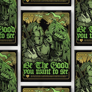 以下が含まれることがあります： 緑と黒のアートワーク。鎧を着た騎士が盾と剣を持っています。「Be The Good you want to see」の文字がゴシック体で表示されています。追加のテキストには「Don't wait for the world to change around you」が含まれています。