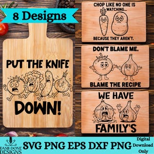 May include: A selection of wooden chopping boards featuring cartoon vegetable designs and humorous text. One board says "PUT THE KNIFE DOWN!" with illustrated vegetables. Other boards have phrases such as "CHOP LIKE NO ONE IS WATCHING..." and "DON'T BLAME ME."