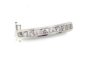 May include: A white gold band ring with a row of round-cut diamonds. The diamonds are set closely together, creating a continuous sparkle. The ring is set against a white background.