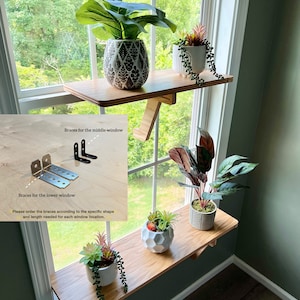 May include: Two wooden shelves mounted on a window frame with potted plants. The shelves are supported by metal brackets. The image includes instructions for installing the shelves, including the text "Braces for the middle window" and "Braces for the lower window".