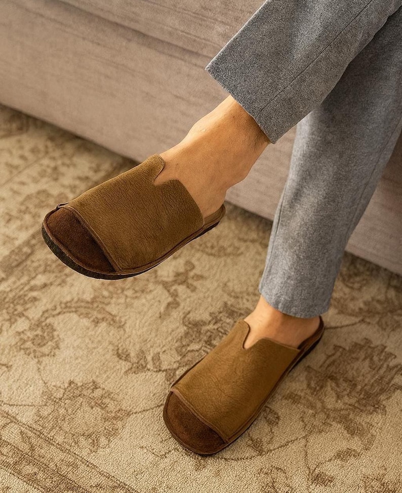 Handmade leather slip-on mules crafted in timeless black and cream colors. Made from genuine leather with a rustic, natural texture, these unisex shoes combine comfort and durability for everyday wear. Available in EU sizes 38–43, but please note: sizing runs small (example: EU 38 fits closer to EU 40). Perfect for summer outfits with jeans or shorts, they are stylish, breathable, and versatile for men and women who value artisan quality.