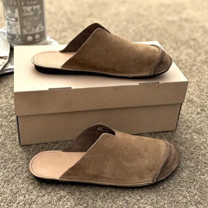 Handmade leather slip-on mules crafted in timeless black and cream colors. Made from genuine leather with a rustic, natural texture, these unisex shoes combine comfort and durability for everyday wear. Available in EU sizes 38–43, but please note: sizing runs small (example: EU 38 fits closer to EU 40). Perfect for summer outfits with jeans or shorts, they are stylish, breathable, and versatile for men and women who value artisan quality.