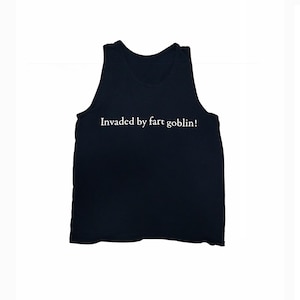 May include: Black tank top with the white text "Invaded by fart goblin!". The sleeveless shirt is made of a soft material and is suitable for casual wear. The text is centered on the front of the shirt.