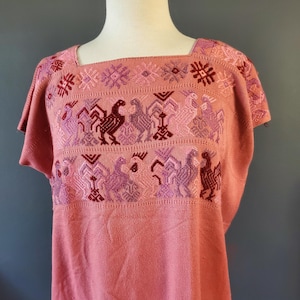 Vintage Huipil with colorful embroidery from Guatemala. Handwoven & hand-embroidered by Mayan Artisans.Raspberry.