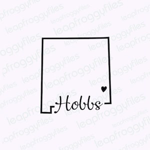 May include: Black and white line drawing of the state of New Mexico with the word "Hobbs" written underneath. A small black heart is in the upper right corner of the state outline.