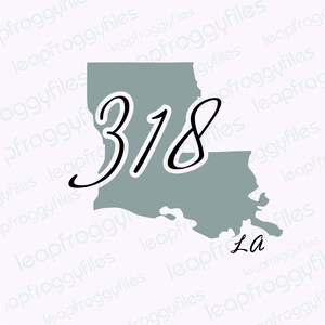May include: A gray outline of the state of Louisiana with the number 318 written in black cursive script. The state abbreviation "La" is written in black cursive script below the outline.