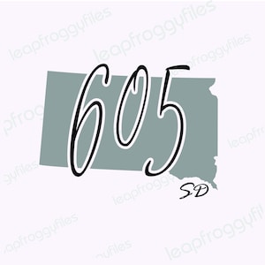 May include: A gray outline of the state of South Dakota with the number 605 written in black cursive inside. The abbreviation "SD" is written in black cursive in the lower right corner of the state outline.