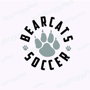 May include: Black and white graphic design with the text "Bearcats Soccer" in a circle around a gray paw print.