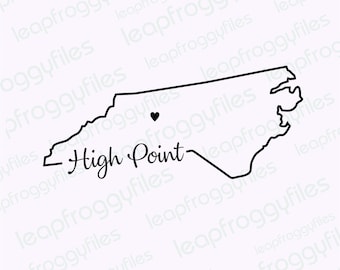 May include: A black and white outline of the state of North Carolina with a small black heart marking the location of High Point, North Carolina. The text "High Point" is written in cursive below the state outline.