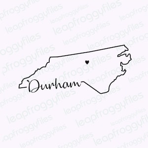 May include: A black and white outline of the state of North Carolina with the word "Durham" written in cursive below the state outline. A small black heart is located in the center of the state outline.