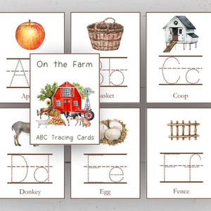 May include: A set of ABC tracing cards with farm illustrations. The cards show an apple, basket, coop, donkey, egg, and fence. The central card reads "On the Farm" with a red barn and farm animals.