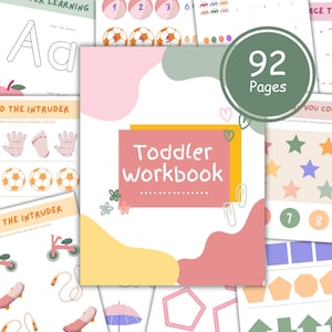 May include: A colourful cover for a toddler workbook with the title "Toddler Workbook" and the number "92 Pages". The cover features a variety of illustrations, including hearts, flowers, and geometric shapes.