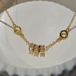 dainty gold baguette charm bracelet