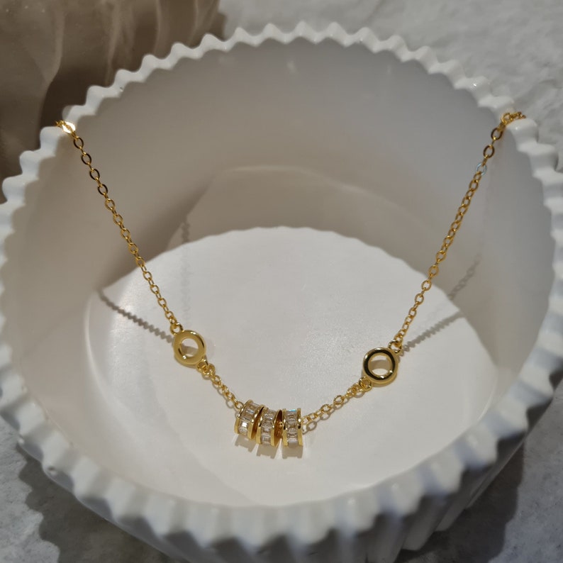 dainty gold baguette charm bracelet