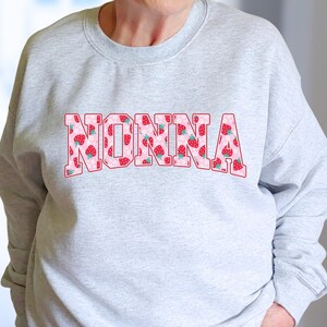 Strawberry-themed retro varsity style Mother's Day PNG shirt designs for sublimation, featuring Mama, Momma, Mini, Gigi, Gram, and Lita in pink red floral fruit print on white t-shirts, digital files for Cricut and heat press crafting, perfect for Mother's Day gifts and matching family outfits on Etsy.