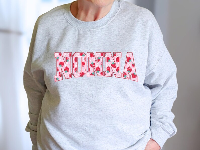 Strawberry-themed retro varsity style Mother's Day PNG shirt designs for sublimation, featuring Mama, Momma, Mini, Gigi, Gram, and Lita in pink red floral fruit print on white t-shirts, digital files for Cricut and heat press crafting, perfect for Mother's Day gifts and matching family outfits on Etsy.