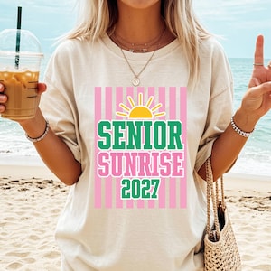 Senior sunrise 2027 design shown printed on white t-shirt, sublimation shirt mockup for class of 2027 senior year tradition