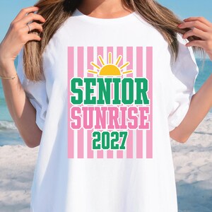 Close-up of varsity senior sunrise lettering with yellow sun graphic, green and pink colorway, bold collegiate style class of 2027 design file