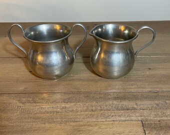 Vintage pewter cream and sugar set. Used condition.