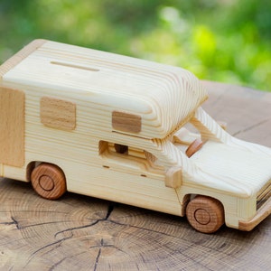 A camping car model made of wood - piggy bank, motorhome