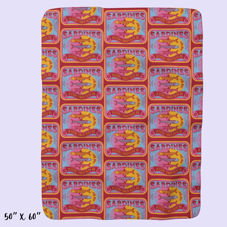 May include: A red and blue patterned fabric with a repeating design of sardine cans. Each can has a label that reads "Sardines in Extra Virgin Olive Oil".
