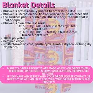 May include: A pink and yellow blanket with a print of sardine cans. The blanket is made of 100% polyester and is available in two sizes: 50" by 60" and 60" by 80". The blanket is professionally printed to order in the USA.