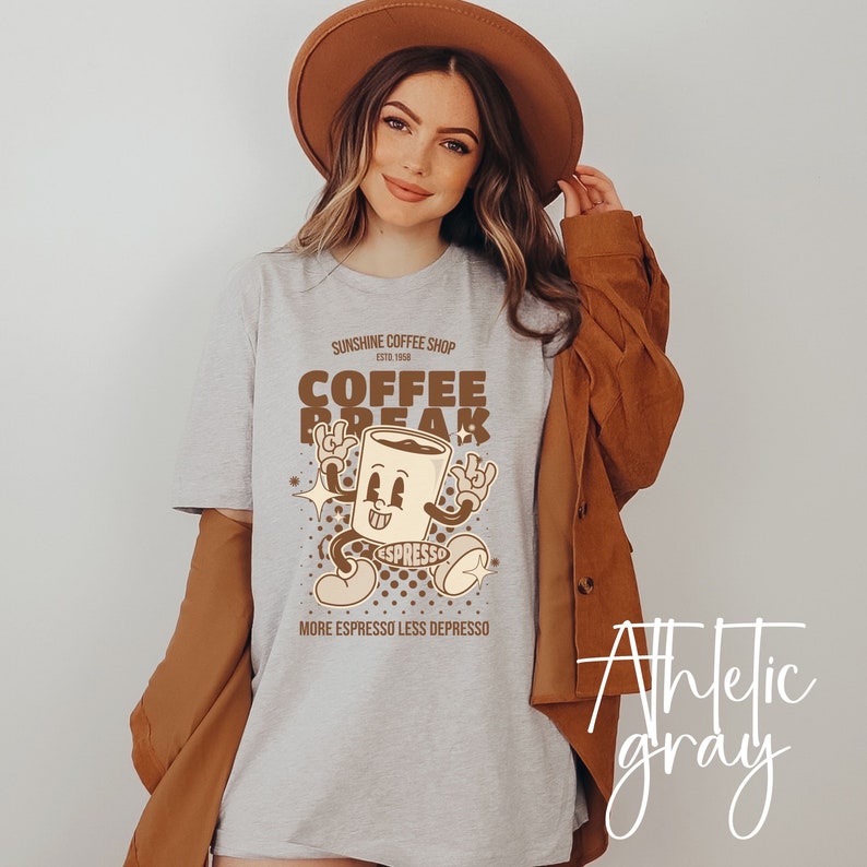 May include: A gray athletic t-shirt with a brown graphic of a cartoon coffee cup with the text "Sunshine Coffee Shop Est. 1958 Coffee Break Espresso More Espresso Less Depresso"
